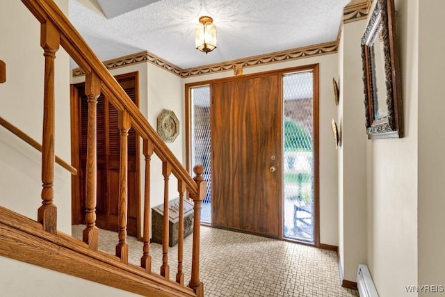 1581 N Forest Rd, Amherst, NY 14221 - entrance foyer with stairway, a textured ceiling, and a baseboard radiator