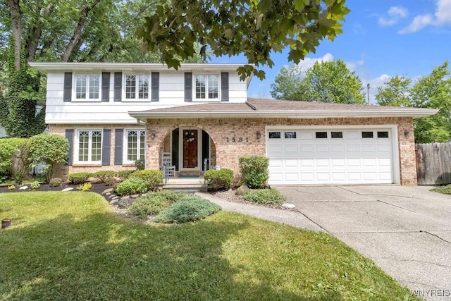 1581 N Forest Rd, Amherst, NY 14221 - traditional home with brick siding, driveway, and a garage