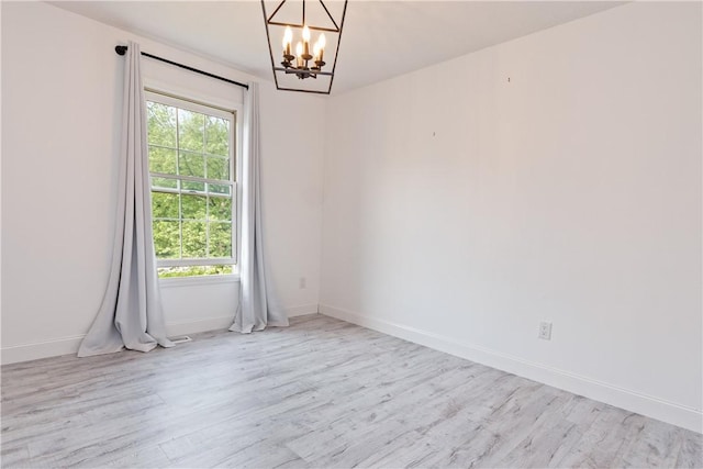 151 Crab Apple Ln, Greece, NY 14626 - empty room with a chandelier and wood finished floors