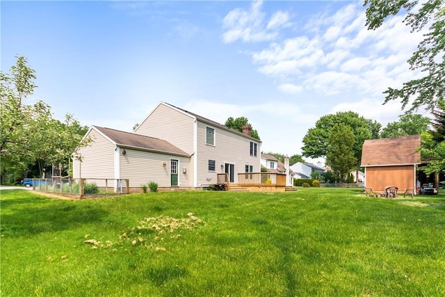 151 Crab Apple Ln, Greece, NY 14626 - back of house featuring a yard, a deck, and a chimney