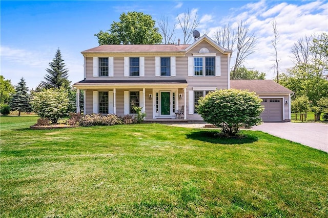 151 Crab Apple Ln, Greece, NY 14626 - view of front of property with an attached garage, asphalt driveway, a front lawn, and covered porch