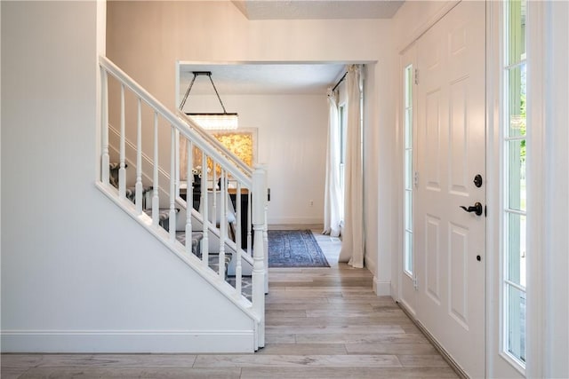 151 Crab Apple Ln, Greece, NY 14626 - foyer entrance featuring stairway and wood finished floors