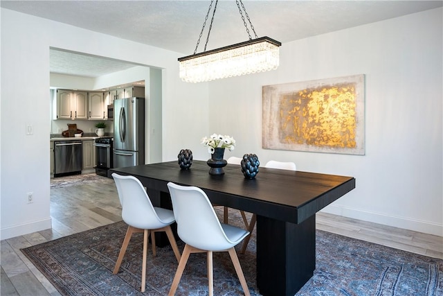 151 Crab Apple Ln, Greece, NY 14626 - dining space featuring wood finished floors and baseboards