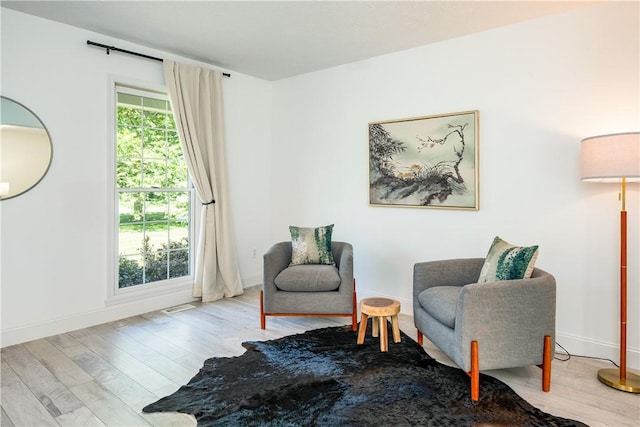 151 Crab Apple Ln, Greece, NY 14626 - living area featuring wood finished floors and baseboards