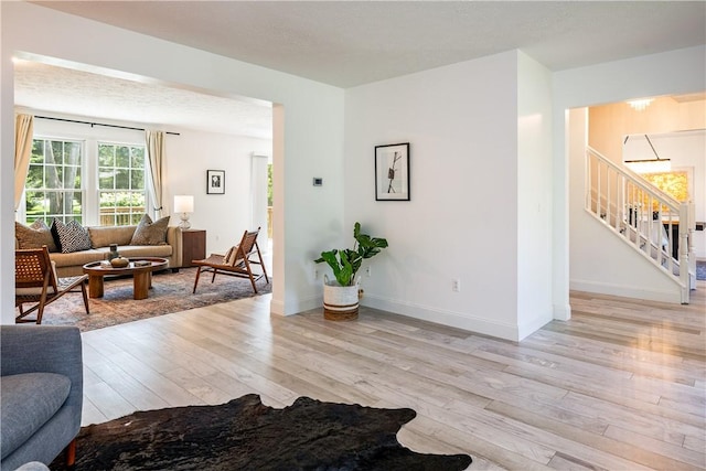 151 Crab Apple Ln, Greece, NY 14626 - living room with light wood-style floors and stairway