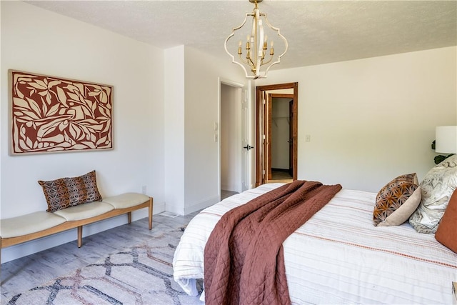 151 Crab Apple Ln, Greece, NY 14626 - bedroom with a chandelier and light wood-style flooring