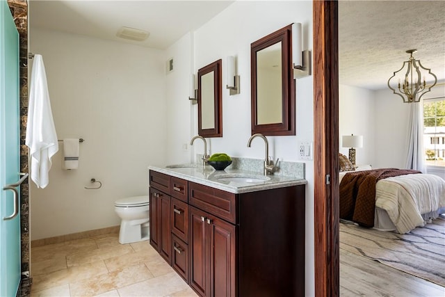 151 Crab Apple Ln, Greece, NY 14626 - bathroom with double vanity, connected bathroom, a chandelier, and tile patterned flooring