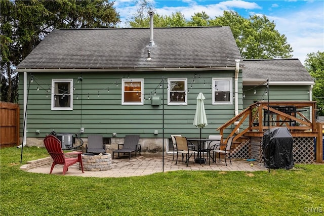 102 Bramley Dr, Camillus, NY 13031 - rear view of house with a yard, a fire pit, a patio, and a shingled roof