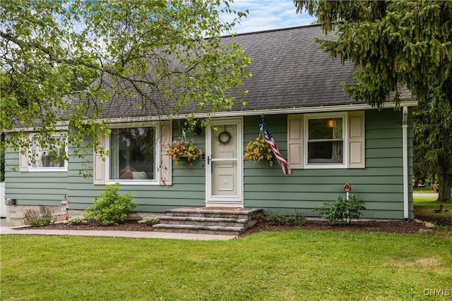 102 Bramley Dr, Camillus, NY 13031 - view of front of home with roof with shingles and a front yard