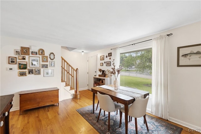 102 Bramley Dr, Camillus, NY 13031 - dining space featuring stairs and light wood finished floors
