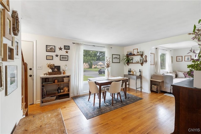102 Bramley Dr, Camillus, NY 13031 - dining room featuring light wood-style floors and arched walkways
