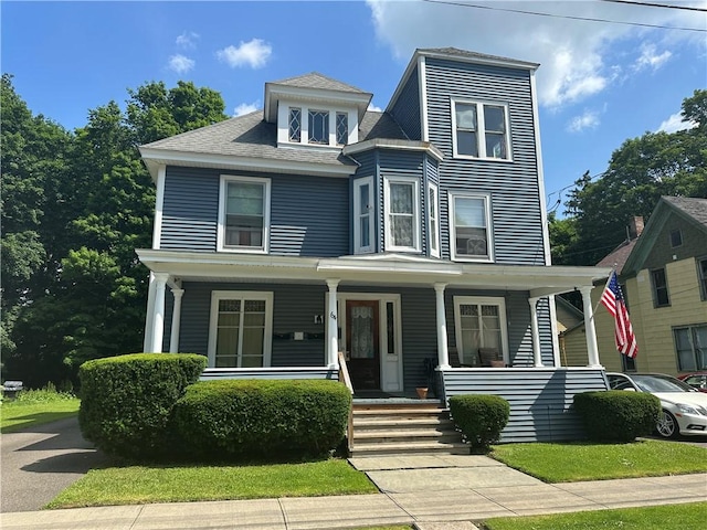 64 Henry St, Norwich, NY 13815 - view of front facade with covered porch and roof with shingles
