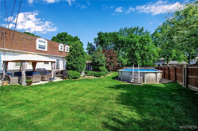 204 Belvoir Rd, Amherst, NY 14221 - fenced backyard featuring an outdoor living space and a gazebo