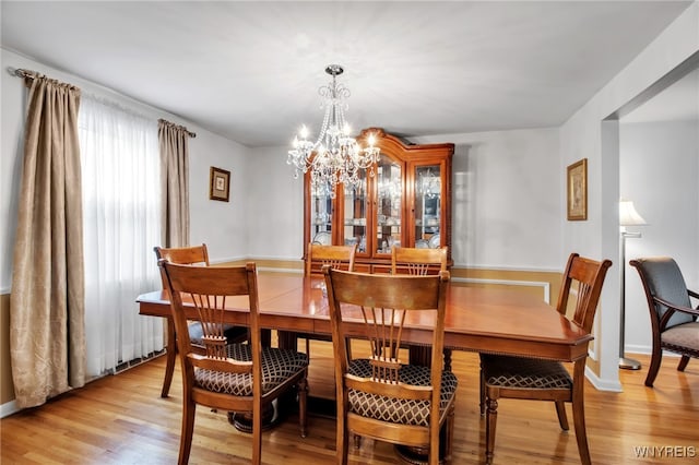 204 Belvoir Rd, Amherst, NY 14221 - dining area featuring a chandelier and light wood-type flooring