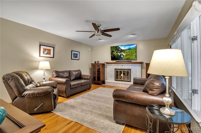 204 Belvoir Rd, Amherst, NY 14221 - living area featuring a ceiling fan, light wood-type flooring, and a fireplace