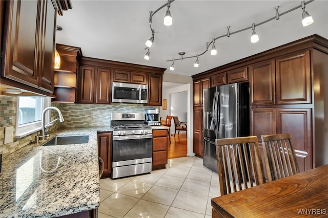 204 Belvoir Rd, Amherst, NY 14221 - kitchen with appliances with stainless steel finishes, tasteful backsplash, open shelves, light stone countertops, and light tile patterned flooring