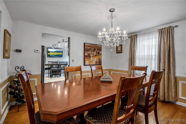 204 Belvoir Rd, Amherst, NY 14221 - dining space with a chandelier and light wood-type flooring
