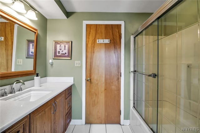 204 Belvoir Rd, Amherst, NY 14221 - bathroom with vanity, tile patterned flooring, and bath / shower combo with glass door