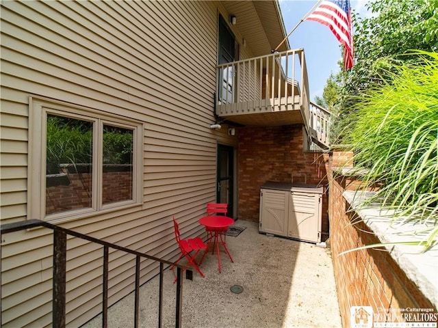 38 Oneida Dr, Chautauqua, NY 14728 - view of side of property with a balcony and brick siding
