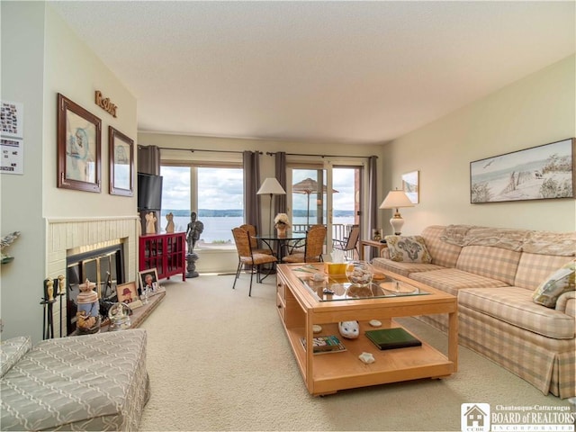 38 Oneida Dr, Chautauqua, NY 14728 - living room with light colored carpet and a fireplace