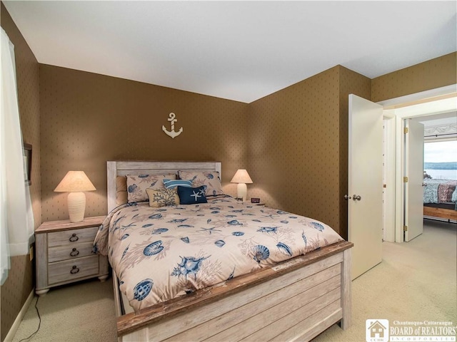 38 Oneida Dr, Chautauqua, NY 14728 - bedroom with light colored carpet and wallpapered walls