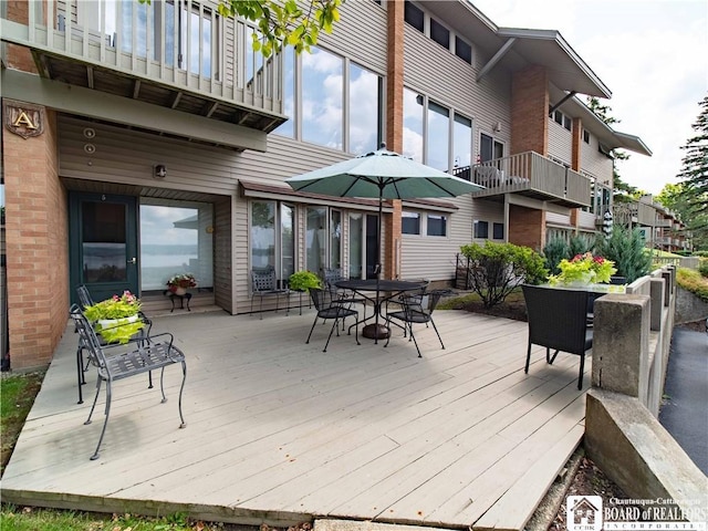 5 Oneida St, Chautauqua, NY 14728 - wooden terrace with outdoor dining area