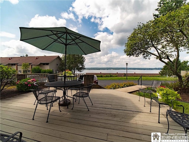 5 Oneida St, Chautauqua, NY 14728 - wooden deck featuring a water view and outdoor dining space