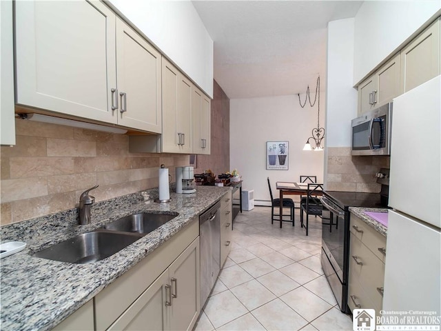 5 Oneida St, Chautauqua, NY 14728 - kitchen featuring stainless steel appliances, backsplash, light tile patterned floors, and light stone counters