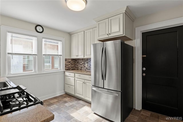 532 Linden Ave, Buffalo, NY 14216 - kitchen featuring stainless steel appliances, stone finish floors, light countertops, and white cabinets