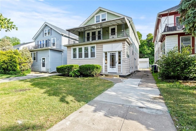 532 Linden Ave, Buffalo, NY 14216 - american foursquare style home featuring a balcony, a front lawn, an outbuilding, and a detached garage