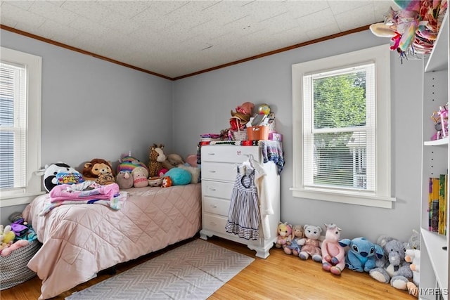 532 Linden Ave, Buffalo, NY 14216 - bedroom with ornamental molding, multiple windows, and wood finished floors