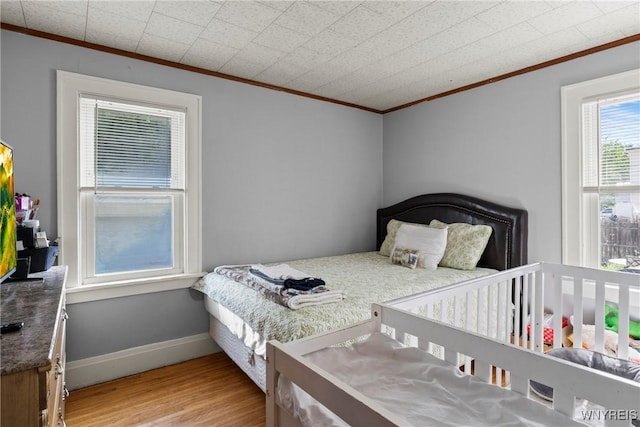 532 Linden Ave, Buffalo, NY 14216 - bedroom with ornamental molding and wood finished floors