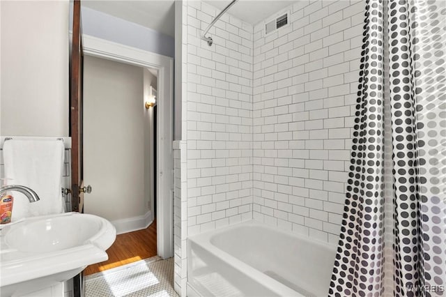 532 Linden Ave, Buffalo, NY 14216 - bathroom featuring shower / bath combo with shower curtain and tile patterned flooring