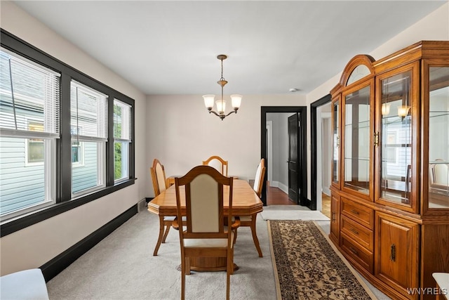 532 Linden Ave, Buffalo, NY 14216 - dining space featuring a chandelier and light colored carpet