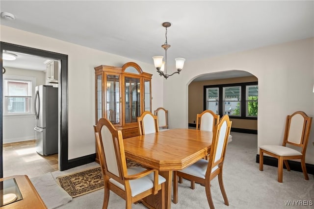 532 Linden Ave, Buffalo, NY 14216 - dining space with arched walkways, plenty of natural light, and a chandelier