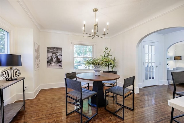 240 Sagamore Dr, Irondequoit, NY 14617 - dining area with dark wood finished floors, arched walkways, a chandelier, and ornamental molding