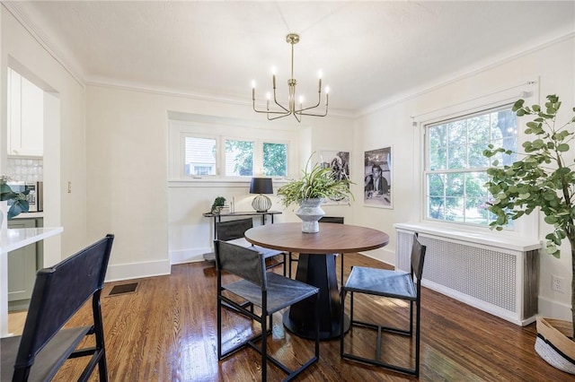 240 Sagamore Dr, Irondequoit, NY 14617 - dining area with radiator heating unit, a chandelier, plenty of natural light, dark wood-style floors, and ornamental molding