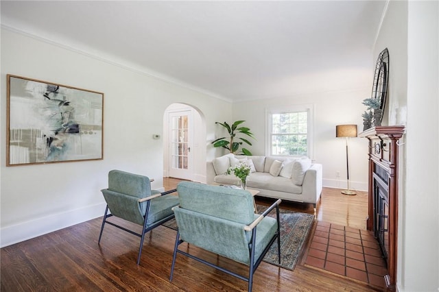 240 Sagamore Dr, Irondequoit, NY 14617 - living room featuring arched walkways, wood finished floors, and ornamental molding