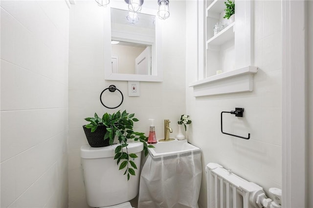 240 Sagamore Dr, Irondequoit, NY 14617 - bathroom featuring radiator and tile walls