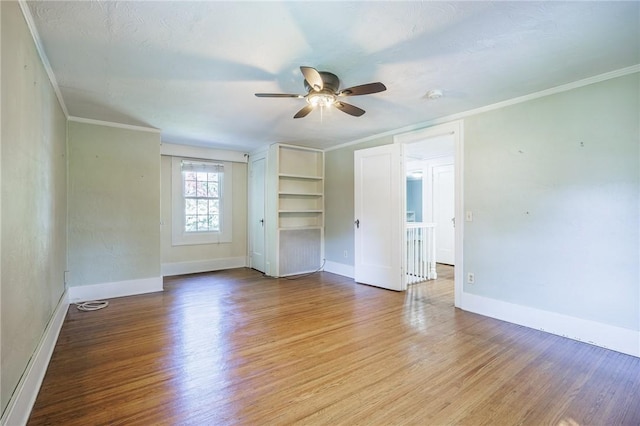 240 Sagamore Dr, Irondequoit, NY 14617 - unfurnished room featuring a ceiling fan, ornamental molding, wood finished floors, and a smoke detector
