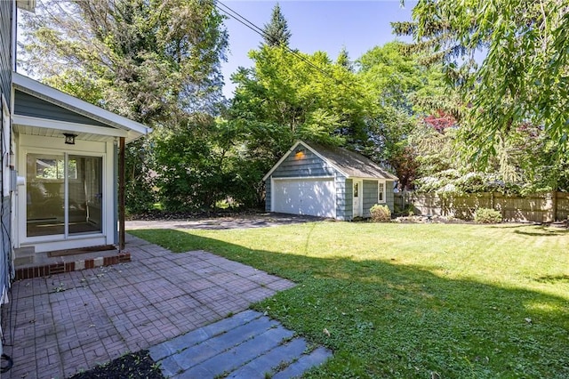 240 Sagamore Dr, Irondequoit, NY 14617 - view of yard featuring an outbuilding, a detached garage, and a patio