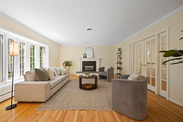 3 Tuxford Rd, Pittsford, NY 14534 - living area featuring french doors, crown molding, light wood-type flooring, a fireplace, and a baseboard radiator