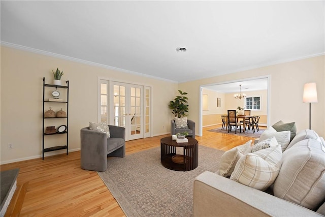 3 Tuxford Rd, Pittsford, NY 14534 - living area featuring a chandelier, light wood-style floors, and crown molding