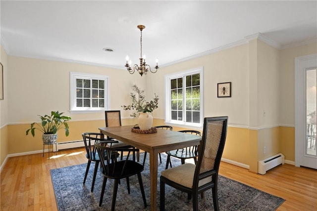 3 Tuxford Rd, Pittsford, NY 14534 - dining area featuring a baseboard radiator, a chandelier, light wood-style flooring, and crown molding