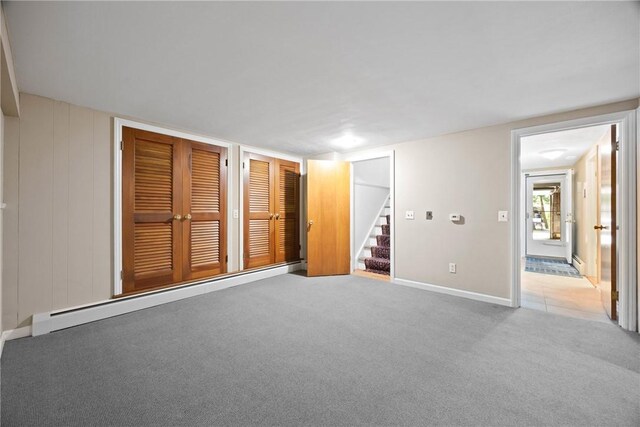 3 Tuxford Rd, Pittsford, NY 14534 - unfurnished bedroom featuring baseboard heating and light colored carpet