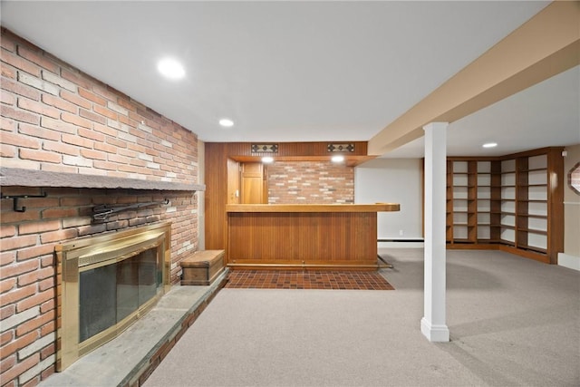 3 Tuxford Rd, Pittsford, NY 14534 - unfurnished living room featuring carpet, bar area, a baseboard radiator, a brick fireplace, and brick wall