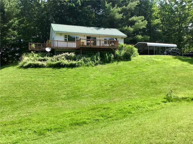10695 Sandy Hill Rd, Dansville, NY 14437 - view of grassy yard with a deck and a carport