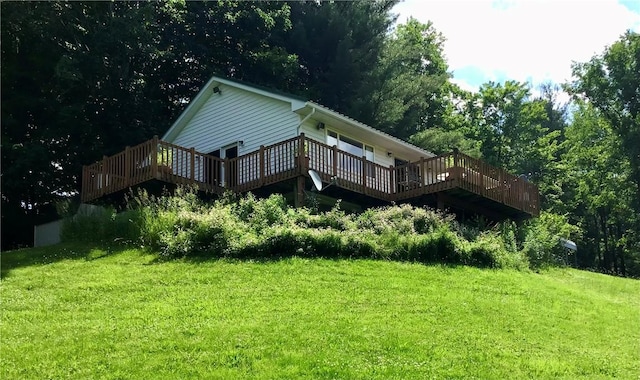 10695 Sandy Hill Rd, Dansville, NY 14437 - rear view of house featuring a wooden deck and a yard