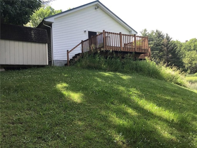 10695 Sandy Hill Rd, Dansville, NY 14437 - view of grassy yard featuring a deck and a storage shed
