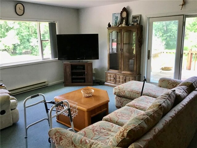 10695 Sandy Hill Rd, Dansville, NY 14437 - carpeted living room with a baseboard radiator
